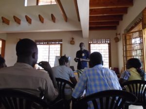 Uncle Robert teaches one of the sessions at the IY house in Kampala